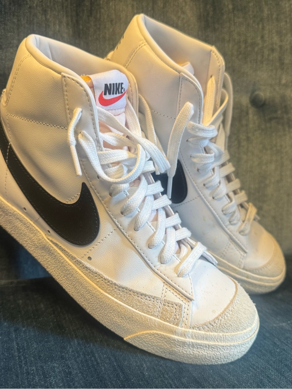 Nike Women’s White High-Top Sneakers with Black Swoosh and Red Tongue Logo